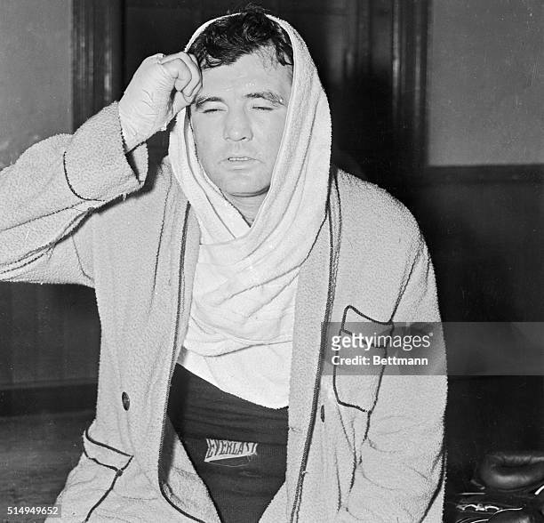 James J. Braddock, former heavyweight champion, wiping perspiration from his forehead, after a workout at Stillman's Gymnasium, May 3, as he started...