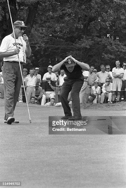 Arnold Palmer makes a 20 foot putt on the 17th hole of the second round of the 1958 PGA Tournament, at the Llanerch Country Club. Palmer drops down...