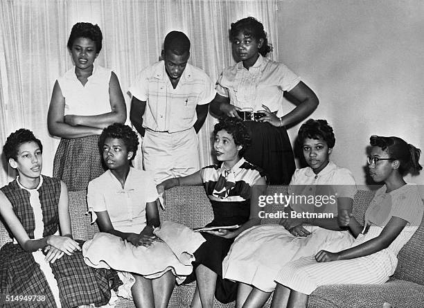 Seven of the nine negro students now attending classes at central high school under protection of federal troops are shown as they met for a short...