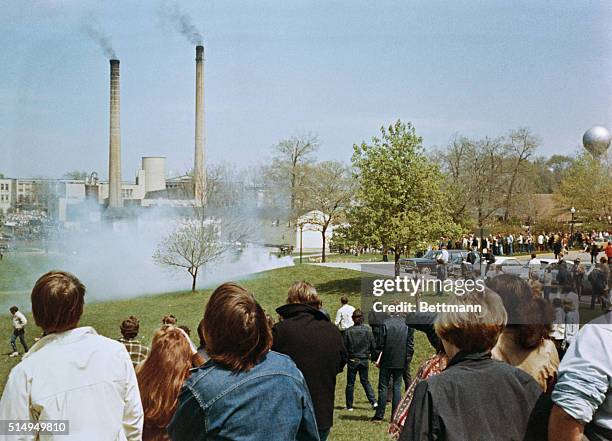 Kent State University students demonstrating against the US war in Vietnam and its expansion into South East Asia are confronted by tear gas of the...