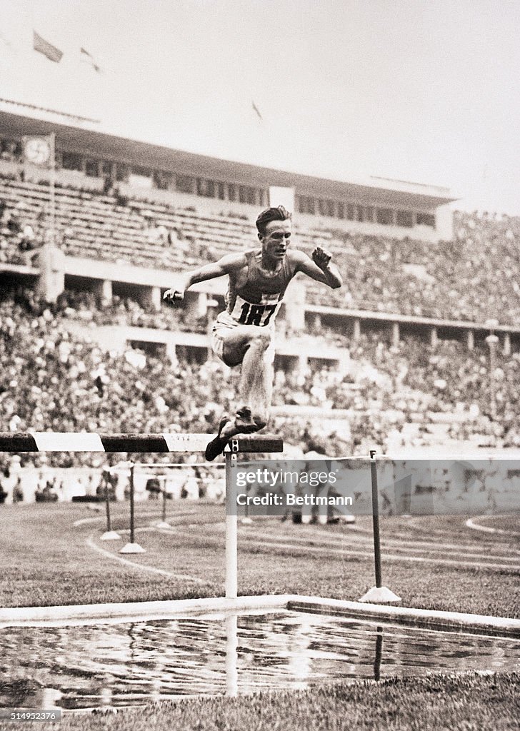 Volmari Iso-Hollo Hurdling in the 3000-Meter Steeplechase