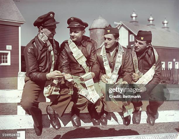 Rehabilitation hospital at Pawling, N.Y. Pawling, New York: Group of AAF gunners back from the war fronts, comparing their short-snorter bills. Left...