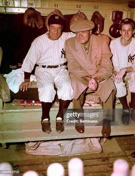 New York, New York: Babe Ruth with Bucky Harris , manager, N.Y. Yankees, and bat boy in dugout at Yankee Stadium on Babe Ruth Day, April 1947.