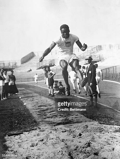Paris, France- Hubbard, the great Negro jumper from the University of Michigan, wins the broad jump at the Olympic contest here. His triumphant leap...