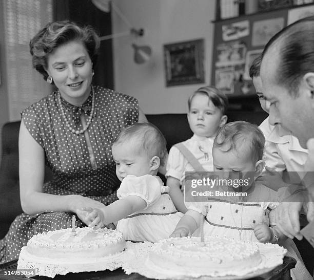 Bergman-Rossellini Twins One Year Old. Rome, Italy: Isabella and Isotta try for a taste of frosting on their first birthday cakes, with famed...