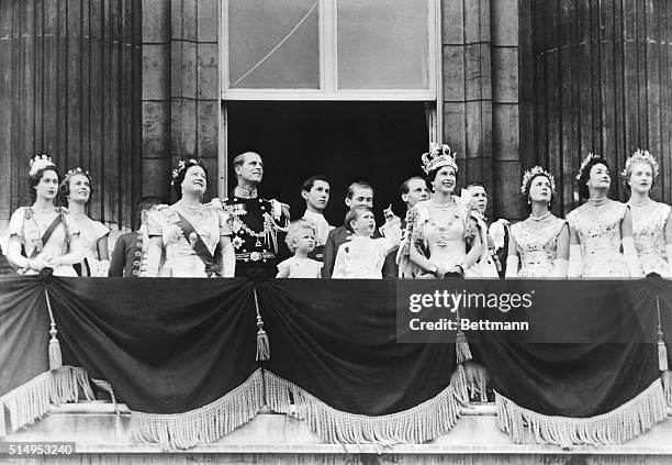 Newly-crowned Queen Elizabeth II , with her children, husband and mother, watch a group of jet planes fly past Buckingham Palace in a salute after...