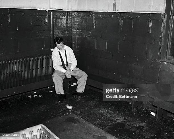 Gordon Howe of the Detroit Red Wings, the last man to leave the Detroit dressing room, sits back exhausted after a 4-2 defeat handed out by the...