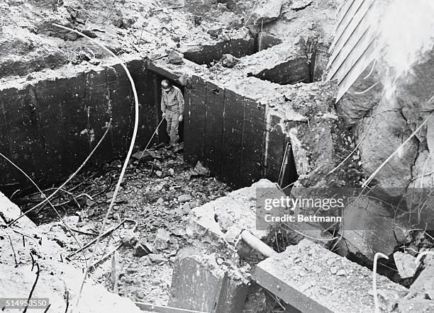 Germany; A Nazi pillbox explosion caused this barrier destruction.