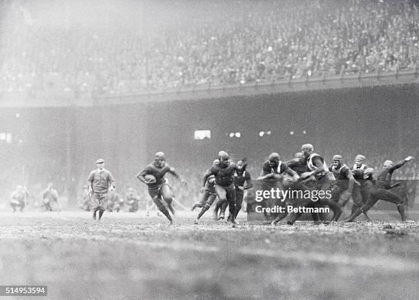 Red Grange scored touchdowns as the Chicago Bears Beat the Yellow Jackets to seven at Philadelphia, December 5. He's shown in above striking photo...
