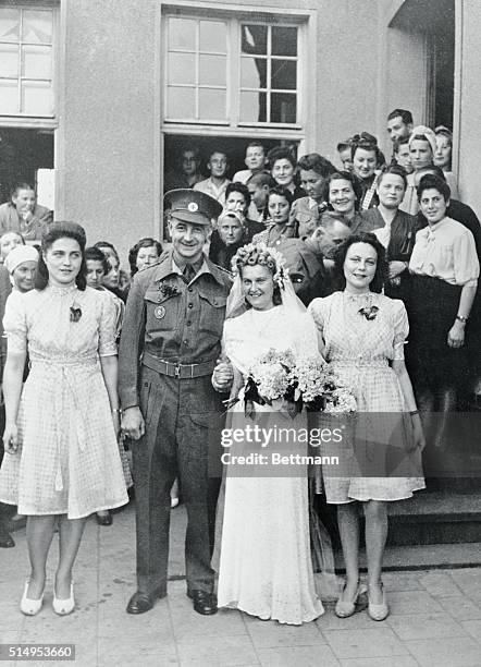 Edward Quattrucci, British Red Cross commission official, and his bride the former Miss Toni Suchecks, of Poland, are shown after their wedding at...