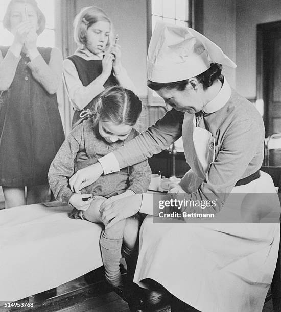 England: A helping hand for little Eileen only seven years old and one of the youngest girls to receive insulin at the unit. But with a few weeks...