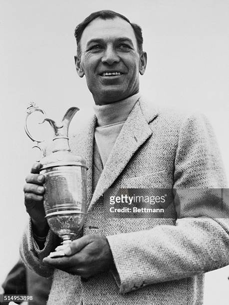 American golfer Ben Hogan holds the British Open cup after winning the tournament at Carnoustie Golf Links.