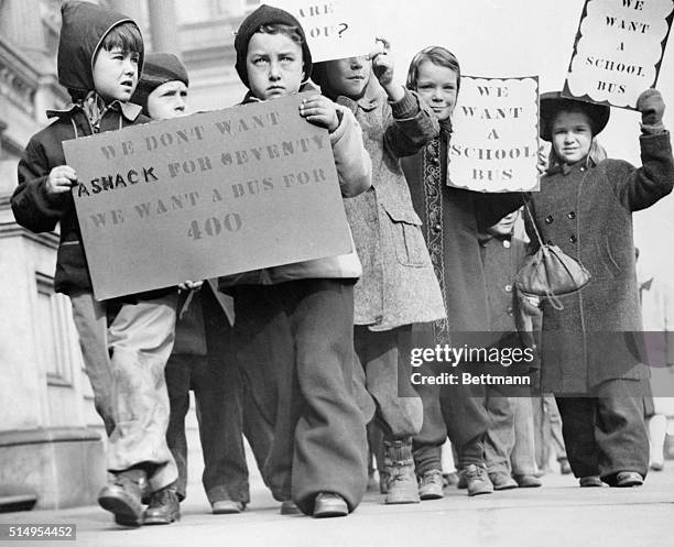 The picketing epidemic has spread to include school children now. These scholars are shown as they picketed the Baltimore City Hall demanding busses...
