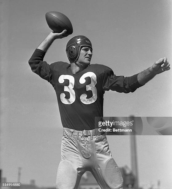 Slingin' Sam, passer par excellence, in a practice session with the Washington Redskins, shows the form that won him fame. Right now, Baugh is in his...