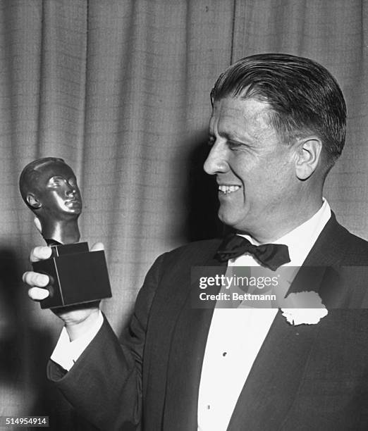 George Stevens, Hollywood motion picture producer, smiles after receiving the Irving Thalberg Award, A special one, credited with the most consistent...