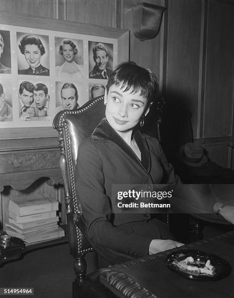 Audrey Hepburn displays her Oscar winning charm here, appearing coy, carried away, and downright happy, as she holds a press conference, the day...