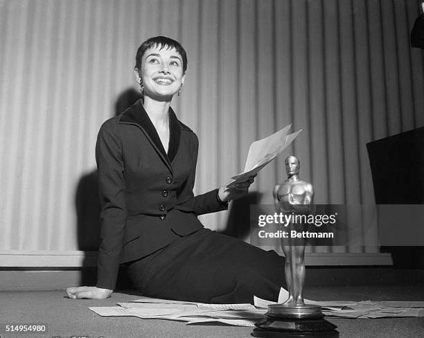 Audrey Hepburn displays her Oscar winning charm here, appearing coy, carried away, and downright happy, as she holds a press conference, the day...