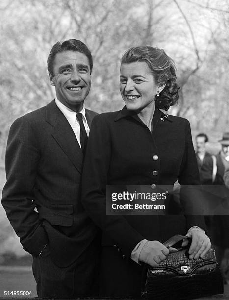 Newly-bethrothed Patricia Kennedy and Peter Lawford, British-born actor, are caught by the camera while enjoying a brisk walk around Central Park in...