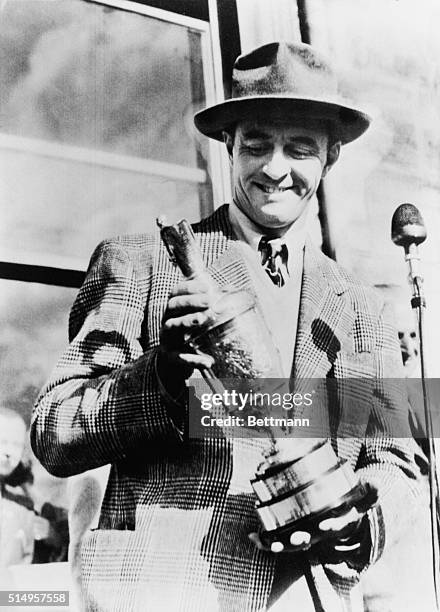 July 9, 1946-American Wins Open Golf Championship: Sam Snead, the American golfer, photographed with the cup after winning the Open Golf Championship...