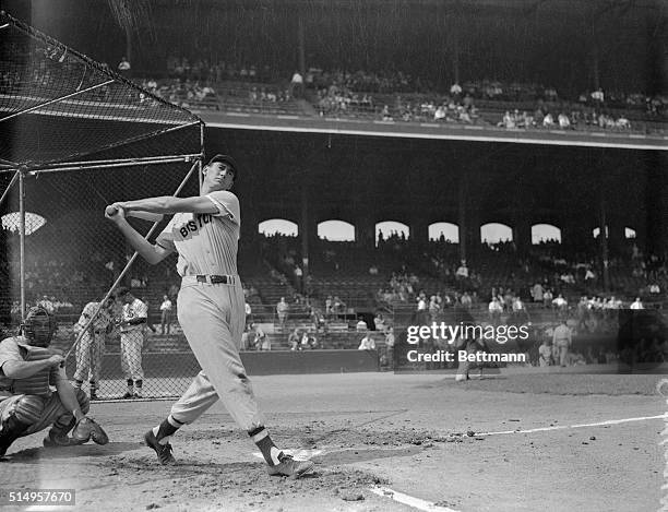 Ted Williams of Boston Red Sox baseball team is shown at batting practice at home plate.