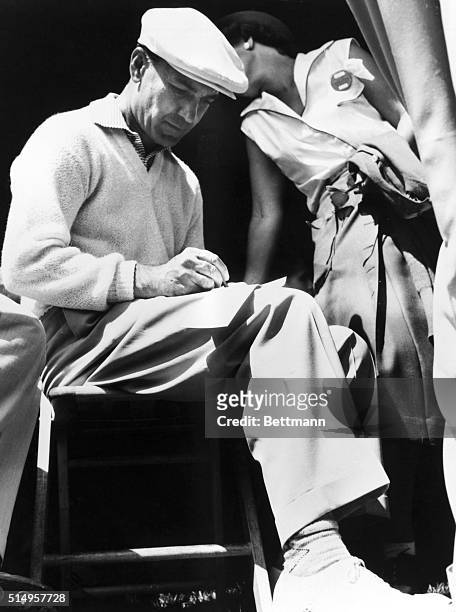 Pro golfer Ben Hogan puts his autograph on fans' scorecards after shooting a par 70 in the second round of the U.S. Open Golf Championships at the...