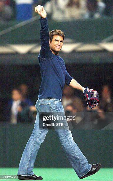 Hollywood actor Tom Cruise acknowledges the audience prior to the Japanese Series baseball championship between Seibu Lions and Chunichi Dragons at...