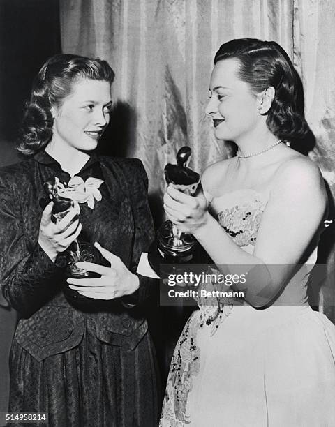 Academy Awards. Los Angeles, Calif.: Fore her performance in To Each His Own, Olivia De Haviland, left, won the "Oscar" for the best actress of the...