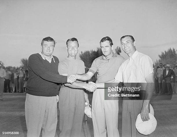 Left to right: Lawson Little, Jimmy Demaret, Lloyd Mangrum and Ben Hogan are shown shaking hands. Hogan and Demaret were winners of the Miami 4-ball...