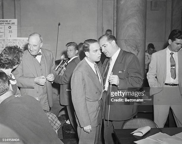 Dramatis Personae in Senate Hearings. Washington: Senator Joseph R. McCarthy holds whispered conference with Roy Cohn after returning to the hearing...