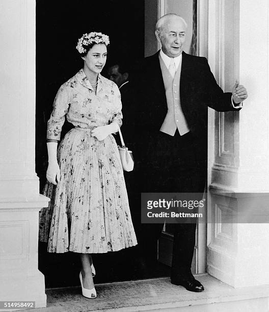 Escorted by West German President Theodor Heuss, Princess Margaret Rose of England leaves the Villa Hammershmidt in Bonn, Germany, on July 12th. The...