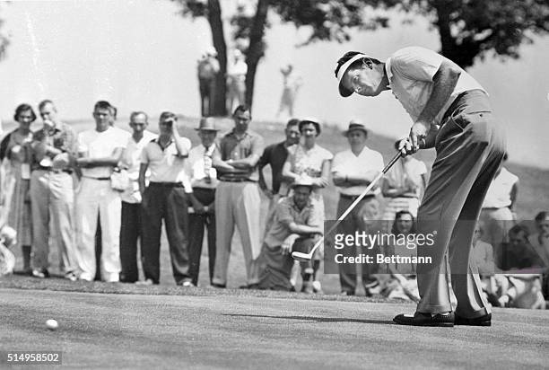 Keeping his eye intently on the ball, Dr. Cary Middlecoff of Kiamesha Lake, New York, putts on the 15th green at Keller Golf Course in the PGA...