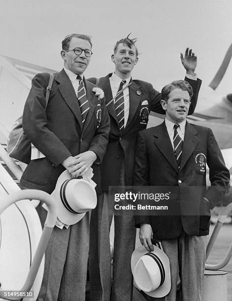 Members of the English team leave Northolt Airport for the Empire Games in Vancouver, B.C. Left to right are: C.W. Brasher; Dr. Roger Bannister,...