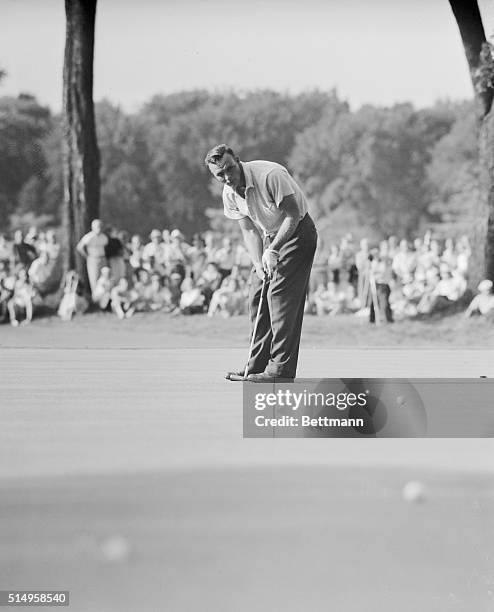 Arnold Palmer making his putt on the 18th green to within a few inches of the cup and close enough for a cinch par four so that he and Sweeny...