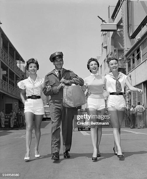 Neither rain nor sleet nor pretty girls keeps Hollywood postman from his appointed rounds at the Columbia Studios. Joe, who will attend the...