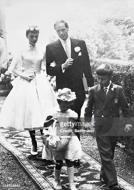 Audrey Hepburn and Mel Ferrer leave the chapel after their wedding at Burgenstock Mountain, overlooking Lake Lucerne. The flower girl and page are...
