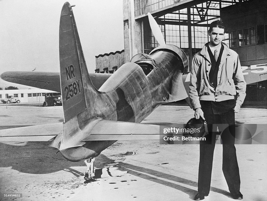 Howard Hughes Standing with His First Plane