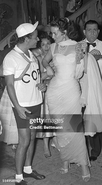 Italian author Pepi Lenzi and Mexican actress Maria Felix, dressed as Italian cyclist Fausto Coppi and his girlfriend, "The White Lady," were among...