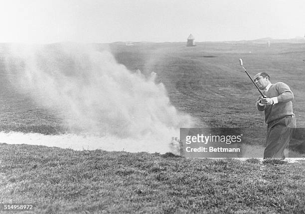 American captain practices for Ryder Cup matches...Walter Hagen, captain of the American team, playing from a bunker at the Royal St. Georges Club,...