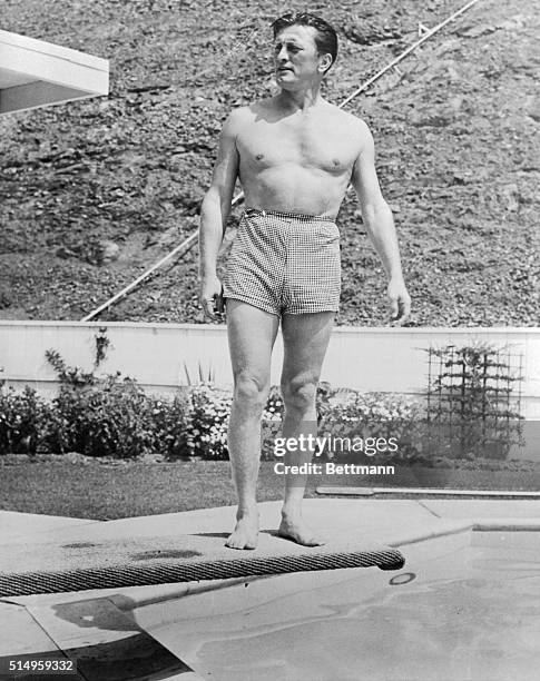 Hollywood star Kirk Douglas, possesses the ideal male physique in the National Judo Association. To prove he has a leg to stand on in any argument...