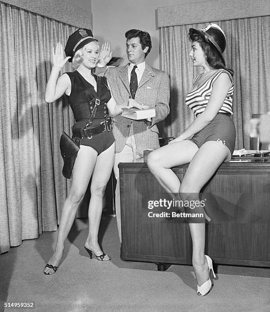 Actor Tony Curtis, , who probably owes his election to Mayor of Universal City to the female population, repays the distaff side by swearing in a...