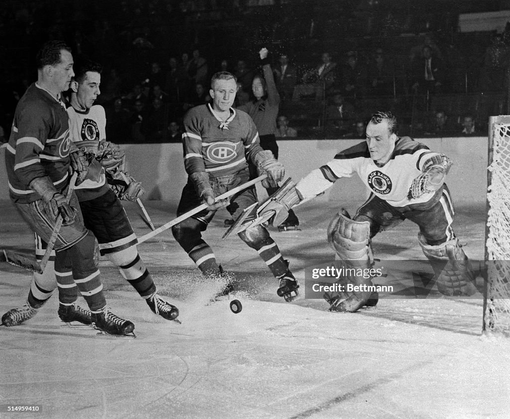 Hockey Players Competing for the Puck