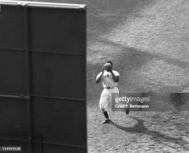 This is a bleacher view of Giant Willie Mays' game-saving eighth-inning catch of Cleveland's Vic Wertz' 450- foot drive to right center field at the...