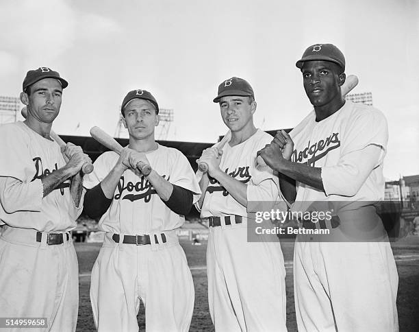 Members of the 1947 Brooklyn Dodgers are, L-R, Spider Jorgensen, Eddie Stanky, Pee Wee Reese, and Jackie Robinson. In 1947 Robinson made his debut...