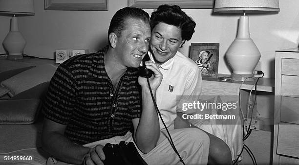 Ralph Kiner, Chicago Cubs outfielder who was traded to the Cleveland Indians November 16th, is shown with his wife, Nancy, as he listens to the news...