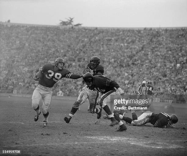 Hugh McElhenny, San Francisco 49er halfback and leading ground-gainer in the National Football League, suffered a complete shoulder separation when...