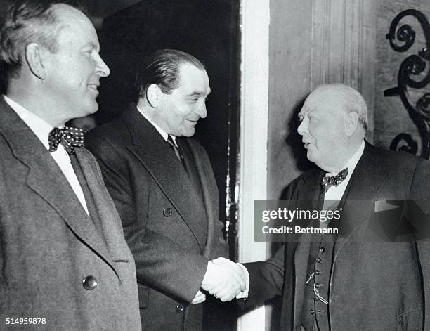 British Prime Minister Sir Winston Churchill greets French Premier Pierre Mendes-France as the latter arrives for lunch at No. 10 Downing Street....