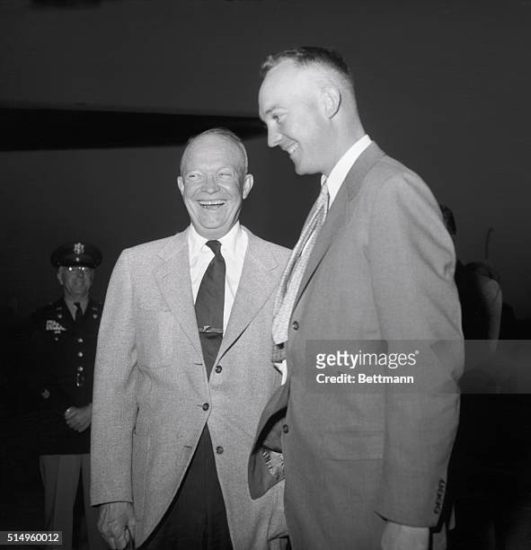 President Eisenhower and his son, Major John Eisenhower, enjoy a laugh together as the Chief Executive's plane stopped in Kansas City, November 10th,...