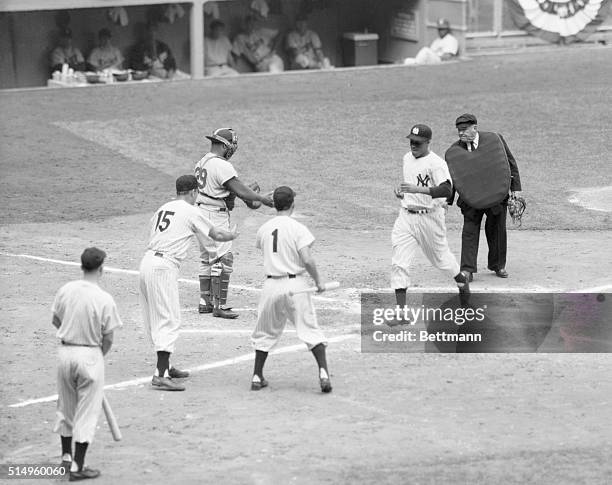 Hits Homer to Right Off the Bat. New York, New York: Yankee rookie Elston Howard crosses the plate at Yankee Stadium after scoring a homer in his...