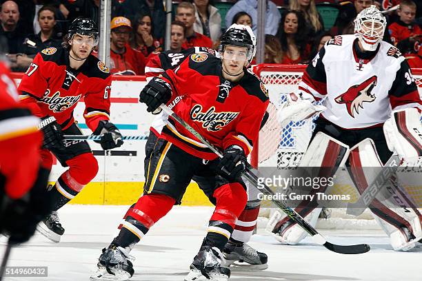 Kenny Agostino of the Calgary Flames skates against the Arizona Coyotes during an NHL game at Scotiabank Saddledome on March 11, 2016 in Calgary,...