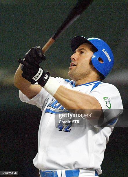 Seibu Lions' Venezuelan slugger Alex Cabrera follows the ball as he hits a grandslam during the Japan's Series baseball championship between Seibu...